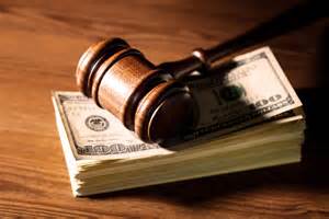 Gavel resting on cash.