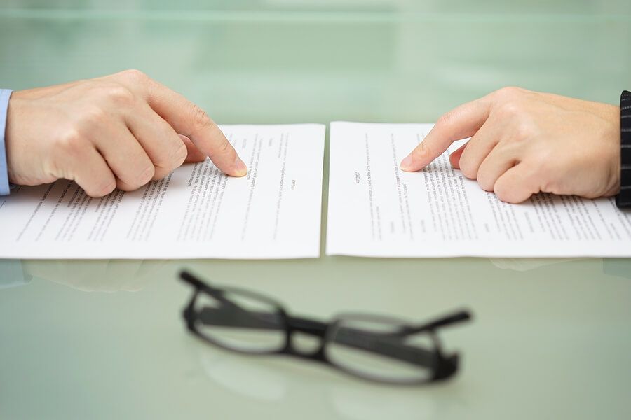two people reading over an agreement