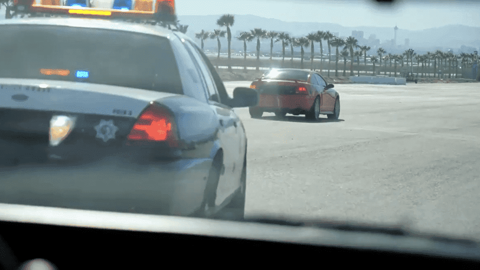police driving behind car