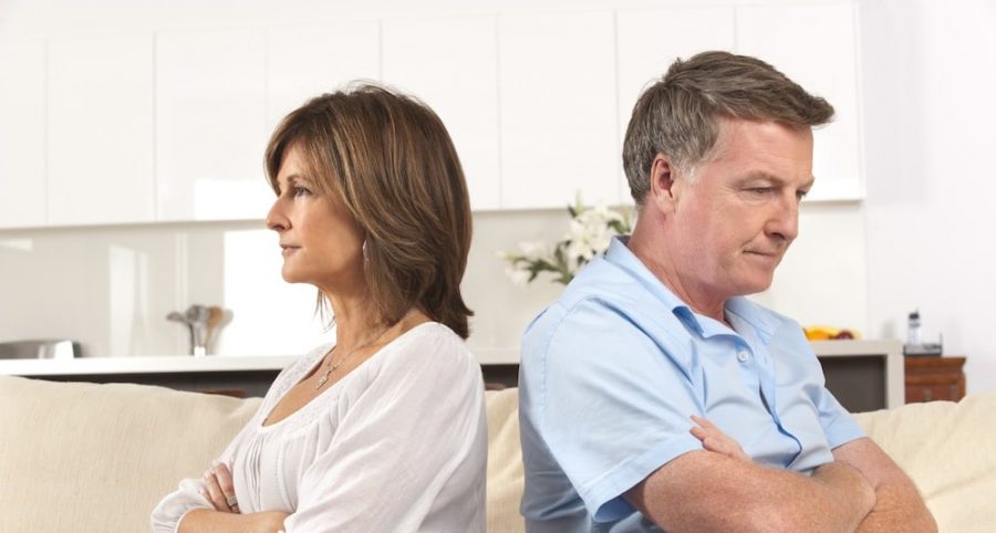 husband and wife facing away from each other
