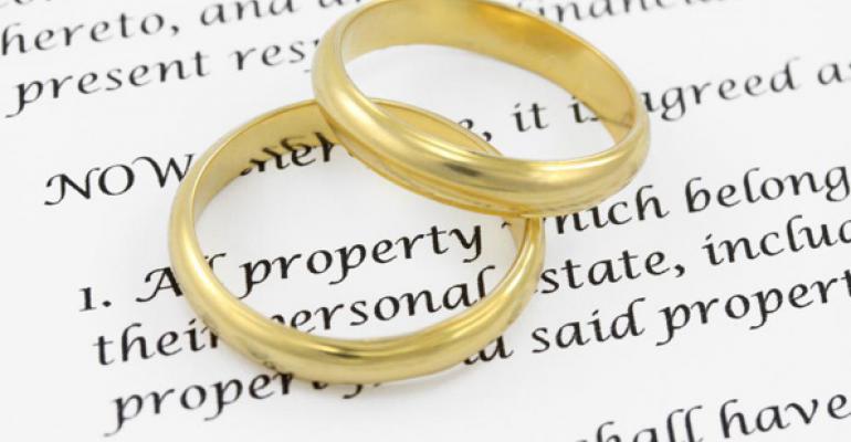 Wedding rings on top of a Texas divorce decree